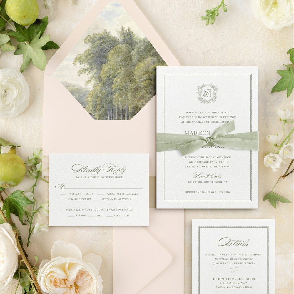 Wedding invitation set with greenery and flowers on a light background