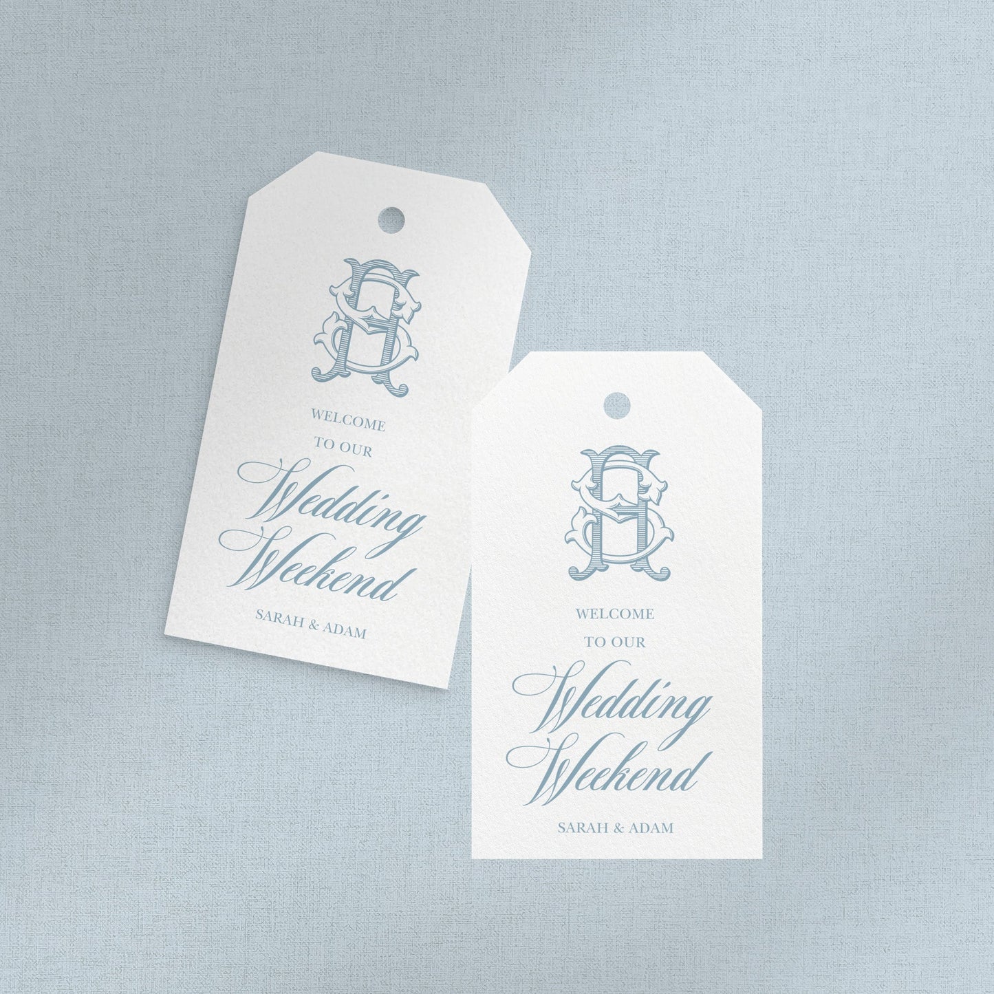 Two white tags with blue text and a logo on a light gray background