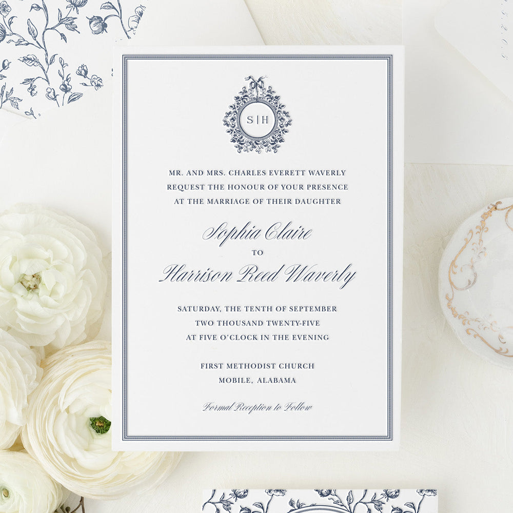 Wedding invitation card with floral design on a white background