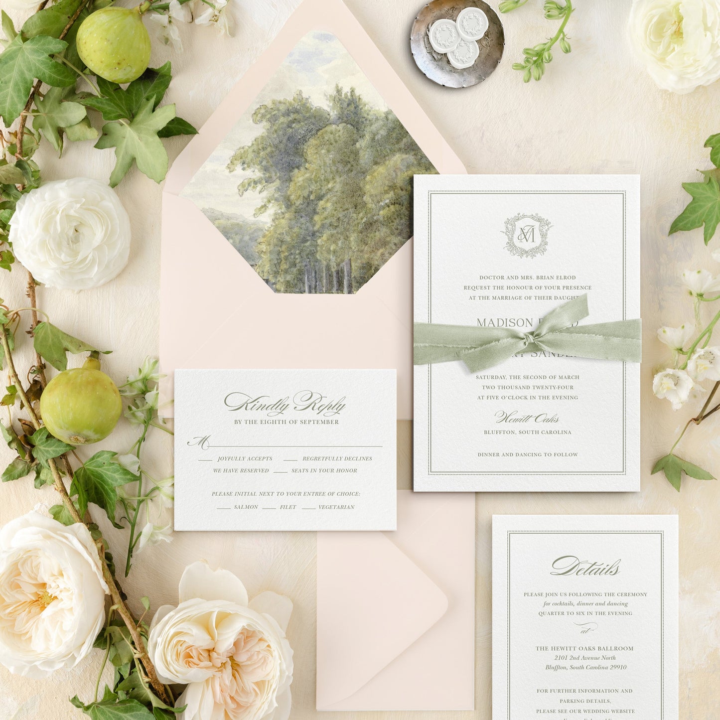 Wedding invitation set with greenery and flowers on a light background