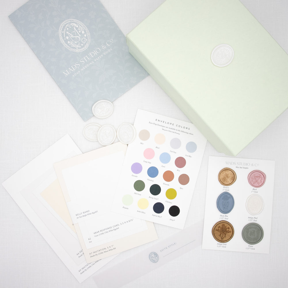 
                  
                    Welcome Box featuring color swatch cards, wax seals, branded insert and a box on white linen background
                  
                